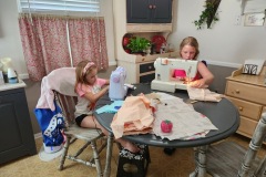 Passing on her love of sewing to her little cousin